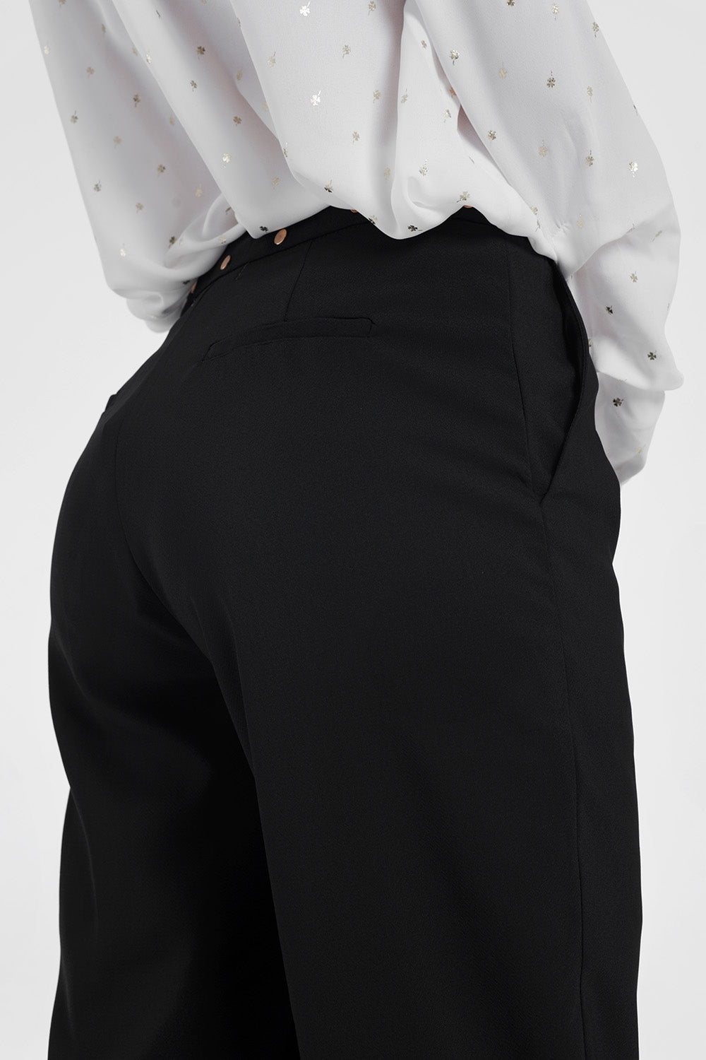 Black pants with wide legs and low hemPants