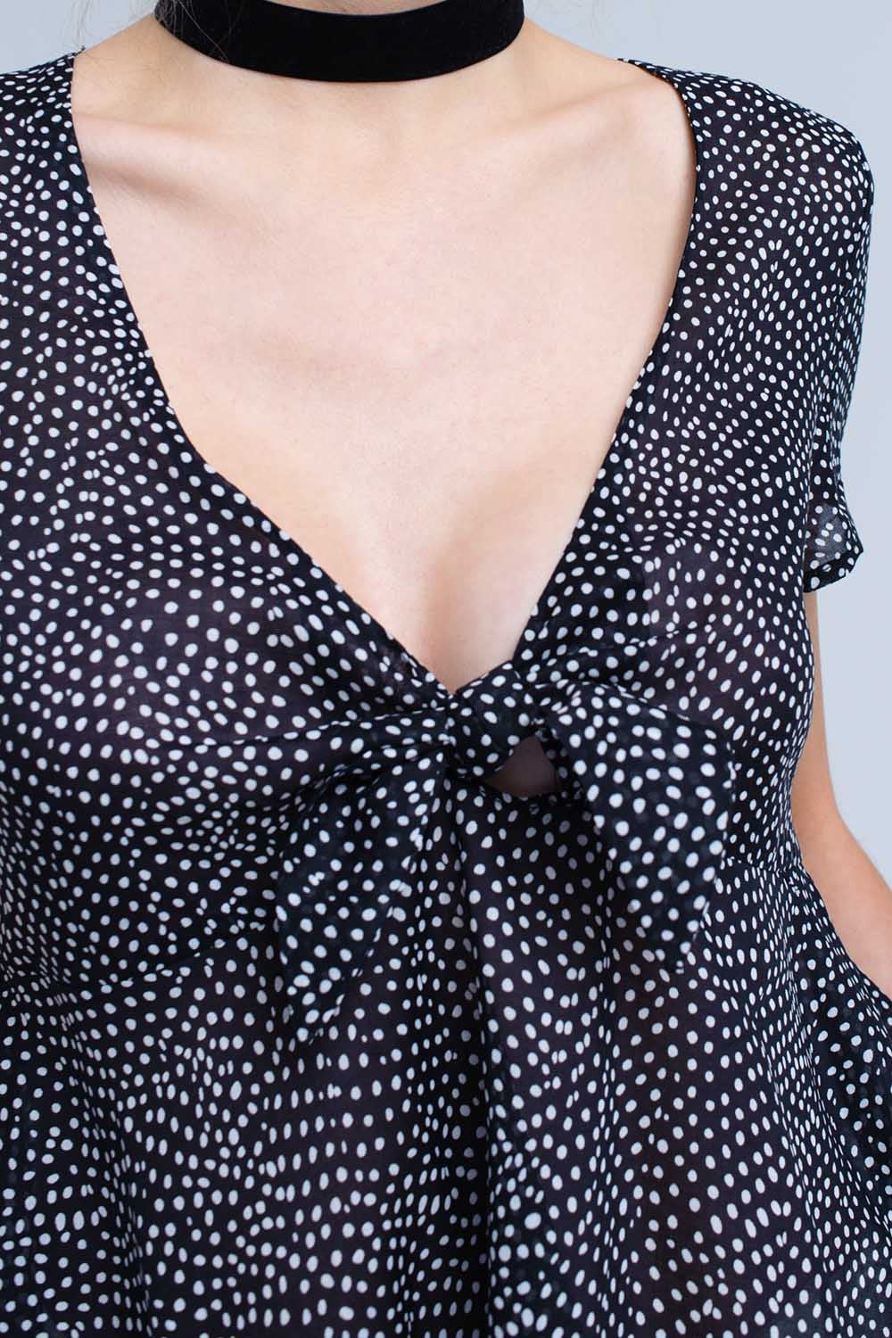 Black polka dot top with ruffle hemShort Sleeve Tops