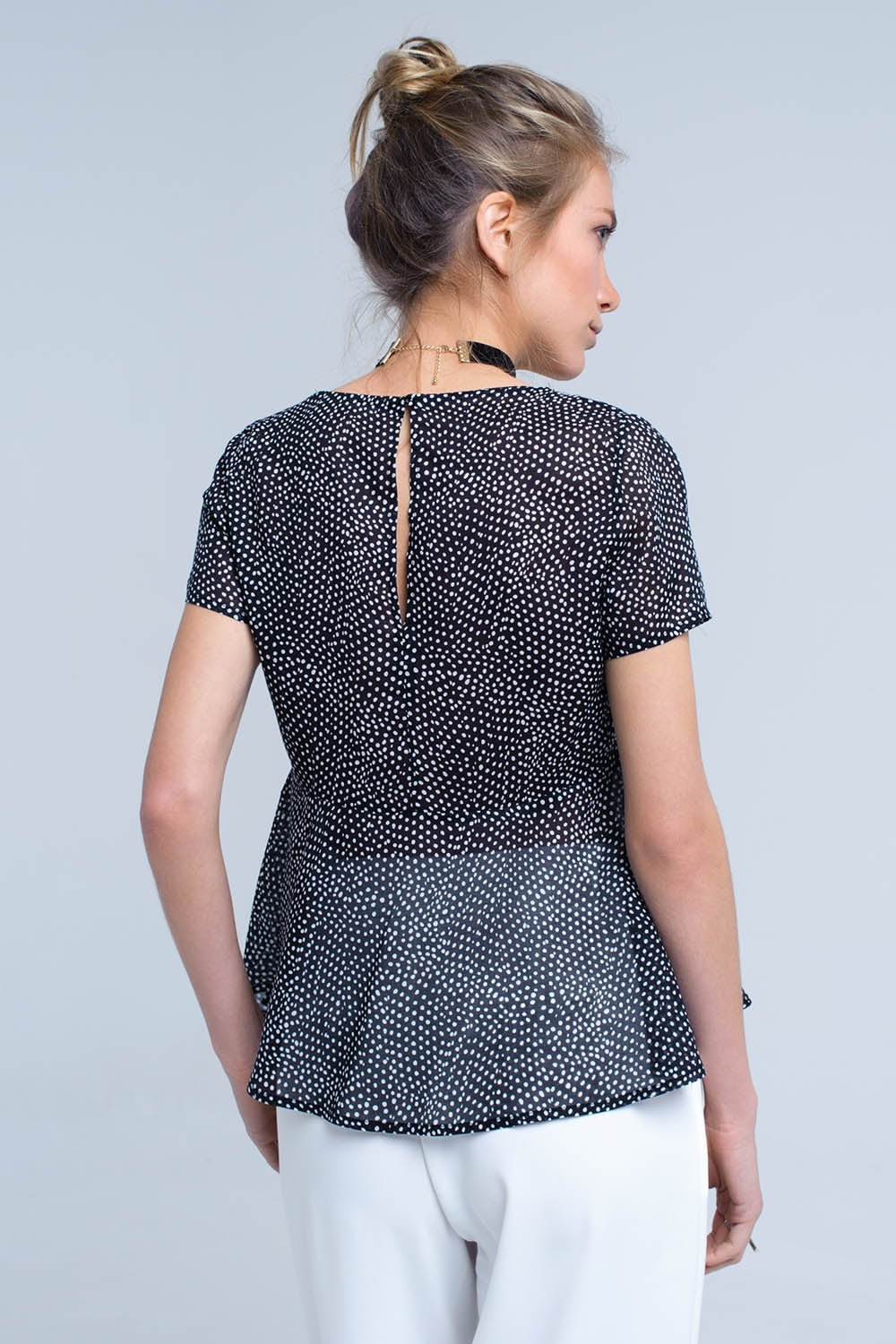 Black polka dot top with ruffle hemShort Sleeve Tops