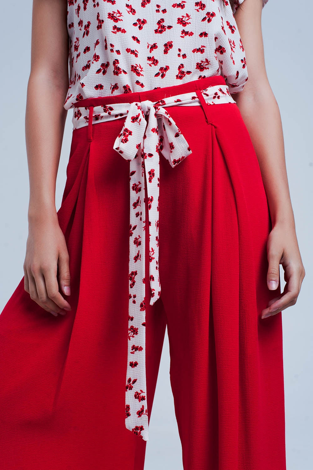 Red pants with floral beltPants