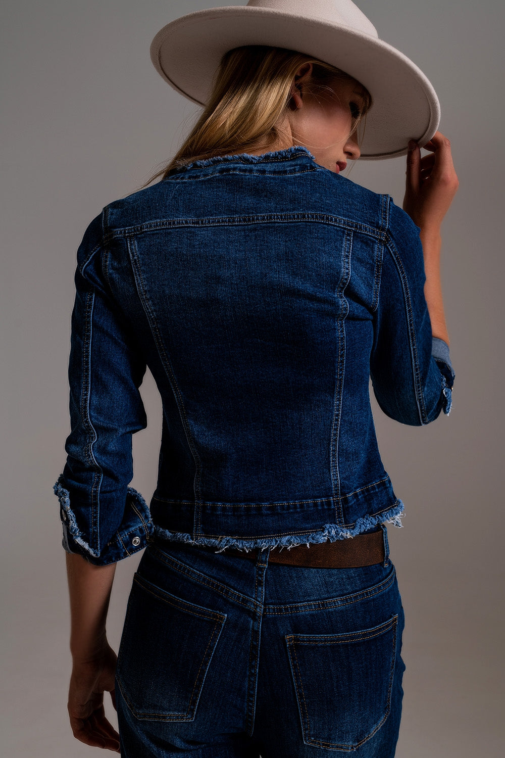 Denim jacket with raw hem edge