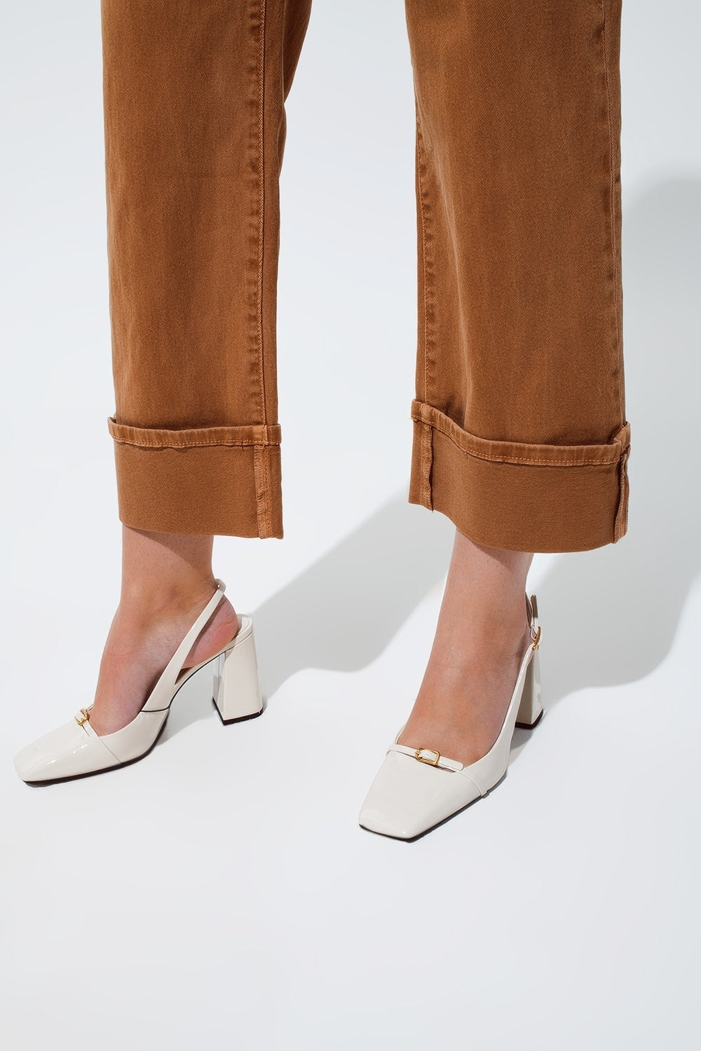 Straight leg jeans in camel with folded trouser legs