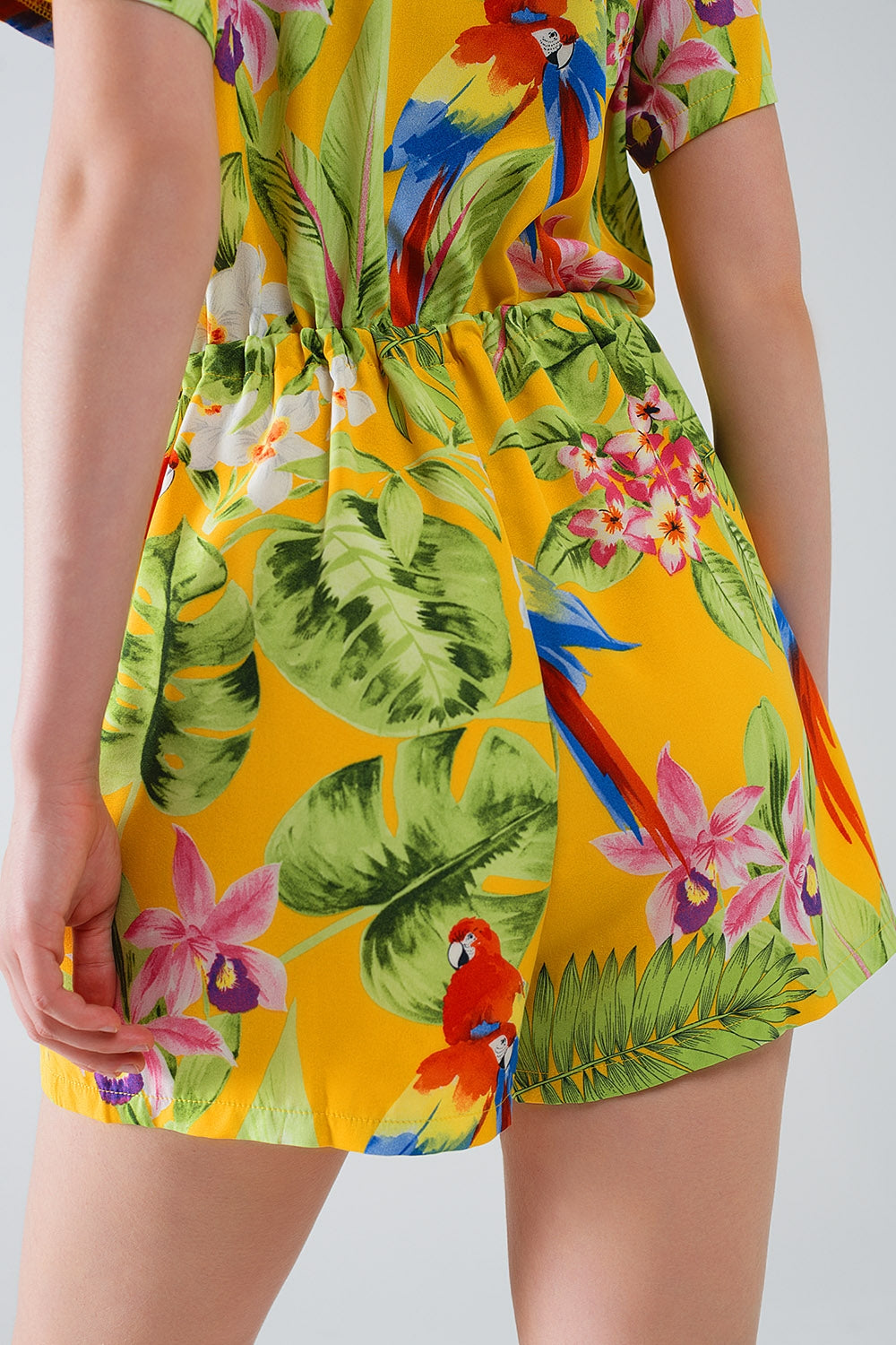 Yellow Short Jumpsuit with Tropical Print and Drawstring Closure