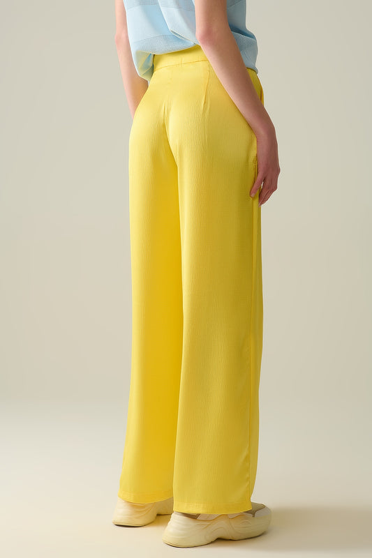 yellow wide leg pants in textured satin