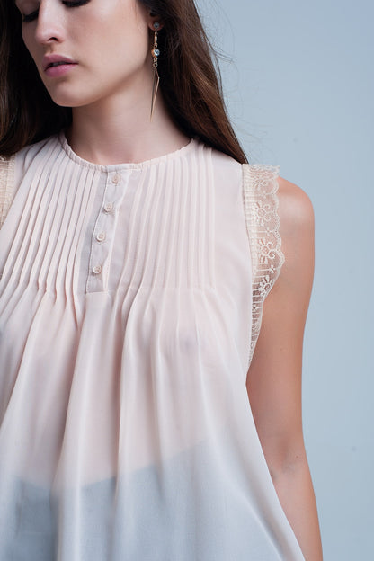Beige sleeveless top with lace detailsSleeveless tops