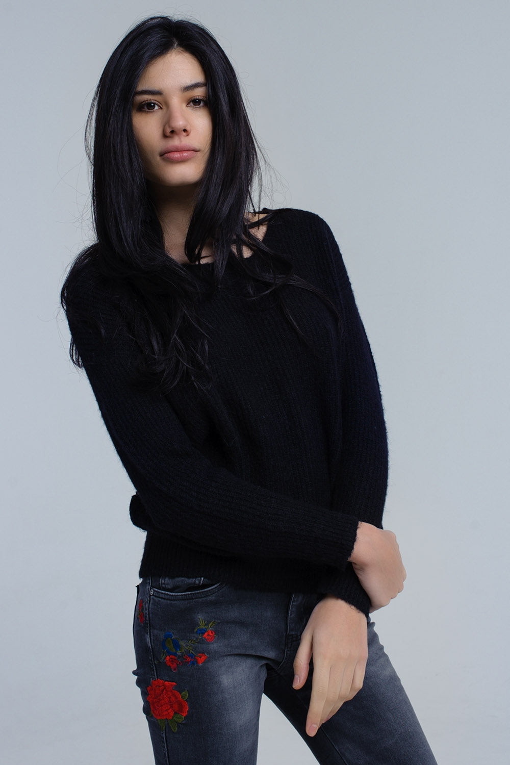 Black knitted sweater with tie-back closureSweaters