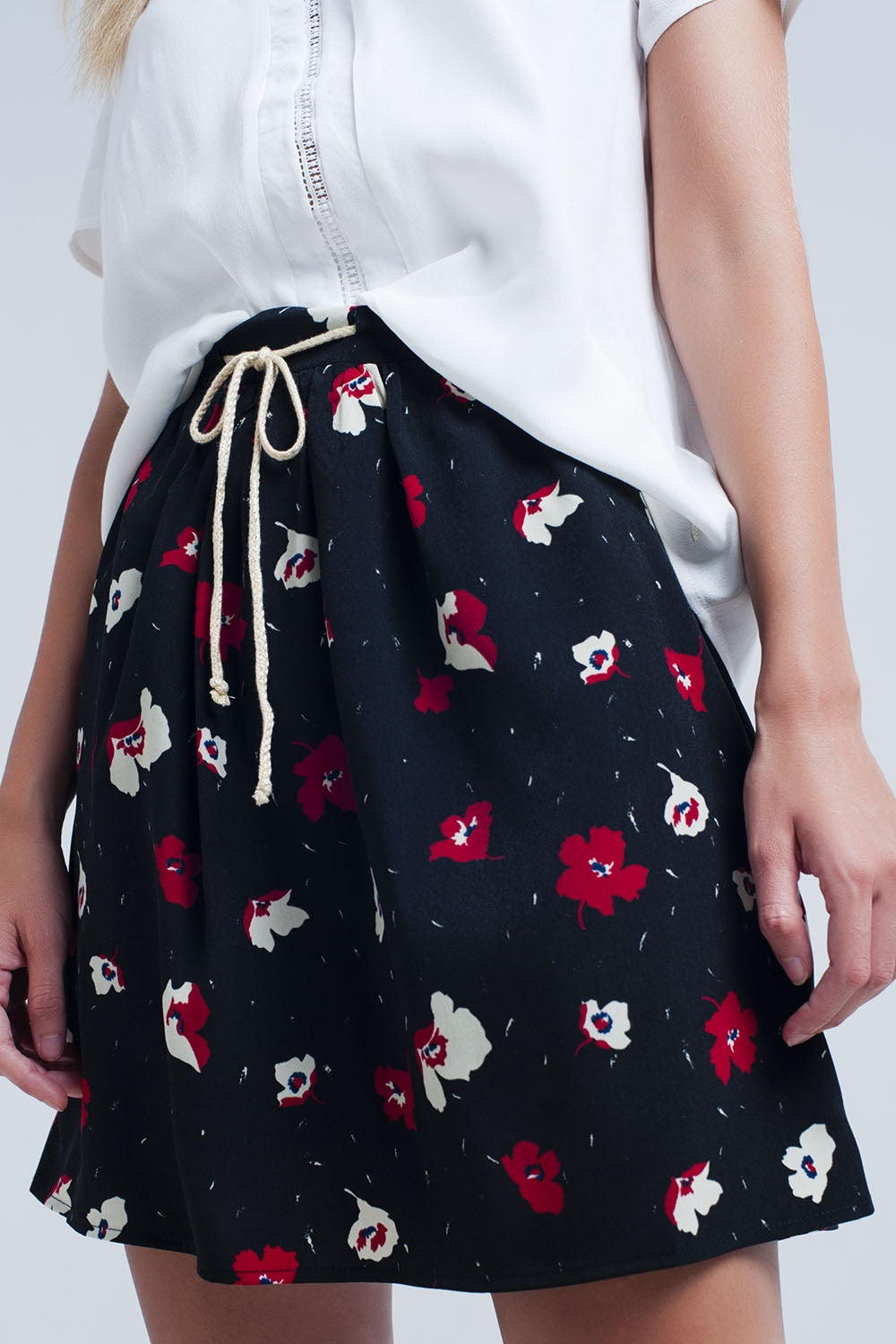 Q2 Black mini skirt with floral pattern