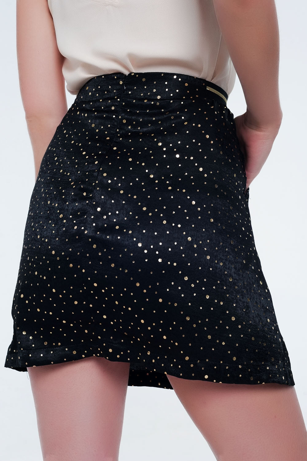 Black mini skirt with pleats in gold polka dotSkirts