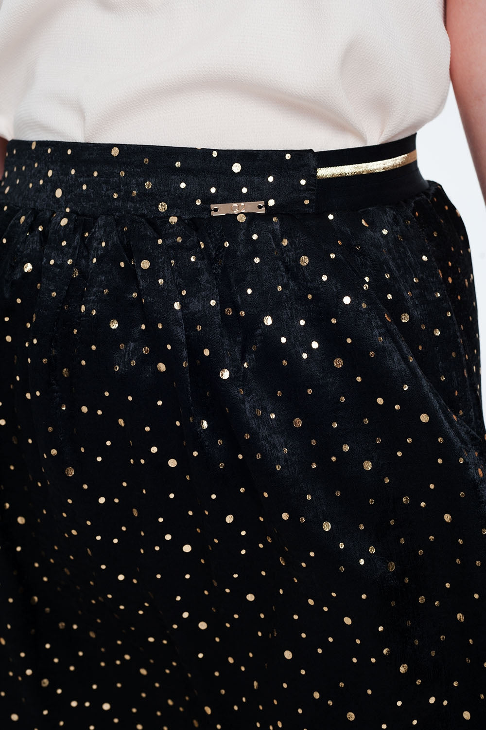 Black mini skirt with pleats in gold polka dotSkirts