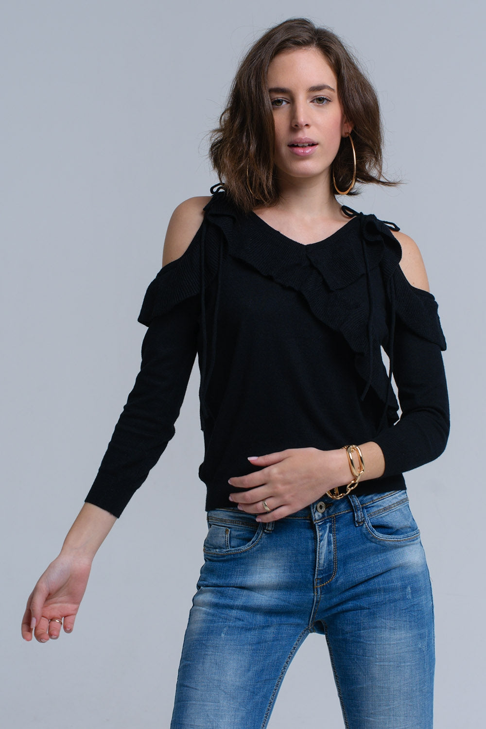 Black sweater with ruffle detail at frontSweaters