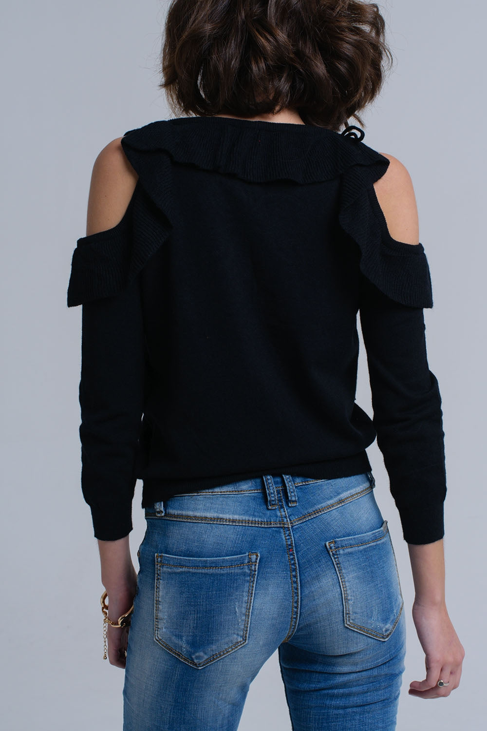 Black sweater with ruffle detail at frontSweaters