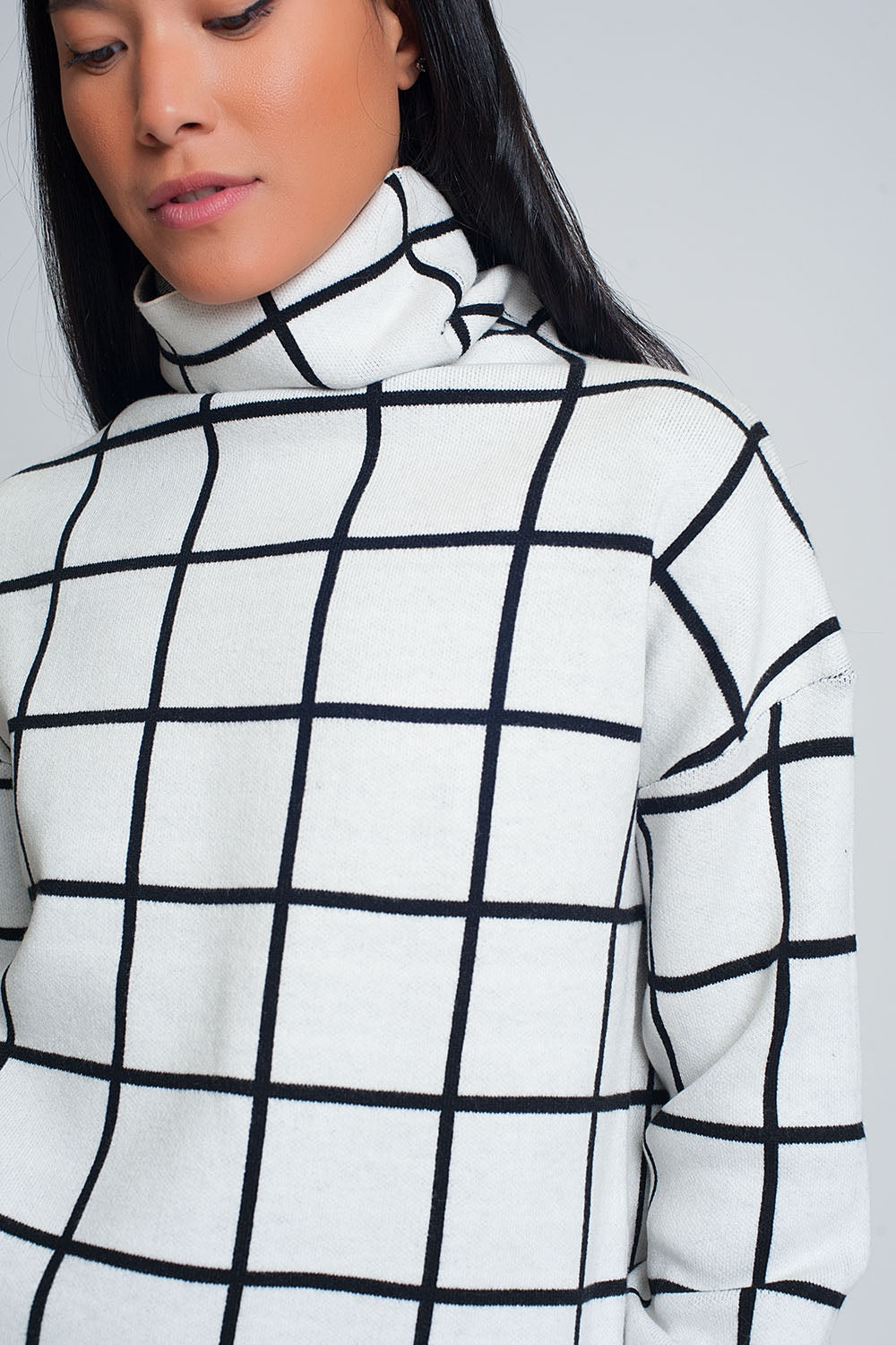 Checkered white turtleneck sweaterSweaters
