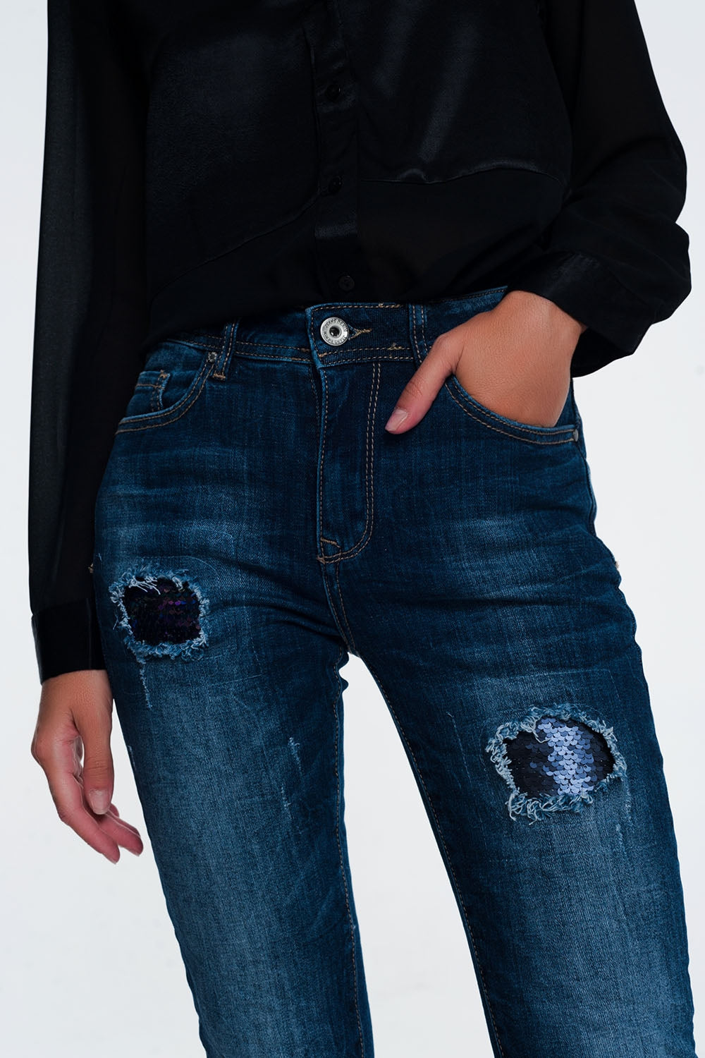 Jeans with sequins and ripsJeans