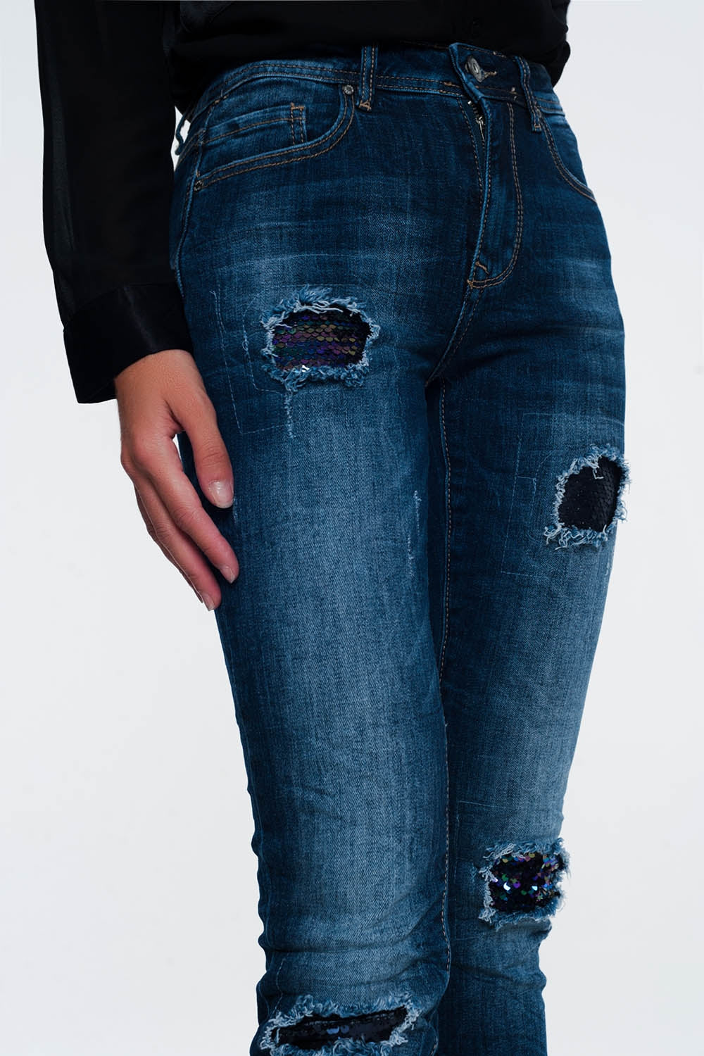 Jeans with sequins and ripsJeans