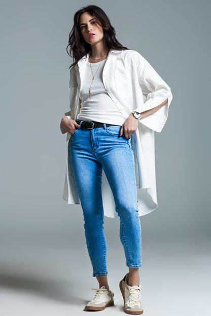 Light blue basic skinny jeans with short slit at hem