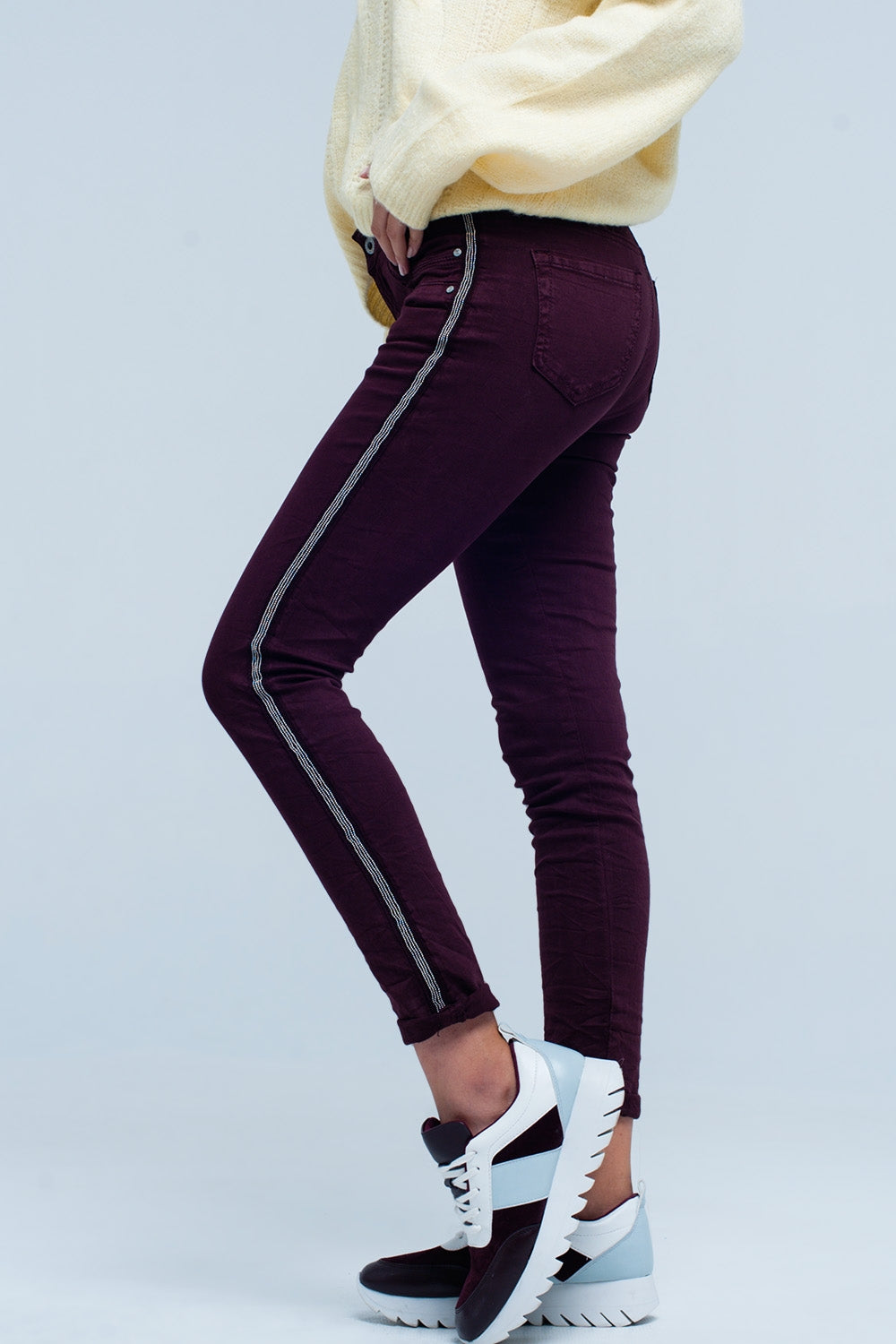 Maroon skinny jeans with metal side stripeJeans