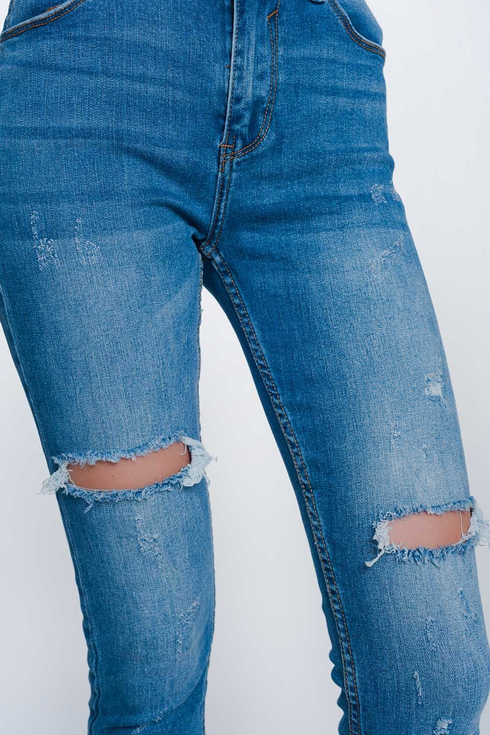 Mid denim super skinny jeans with holes in the kneesJeans