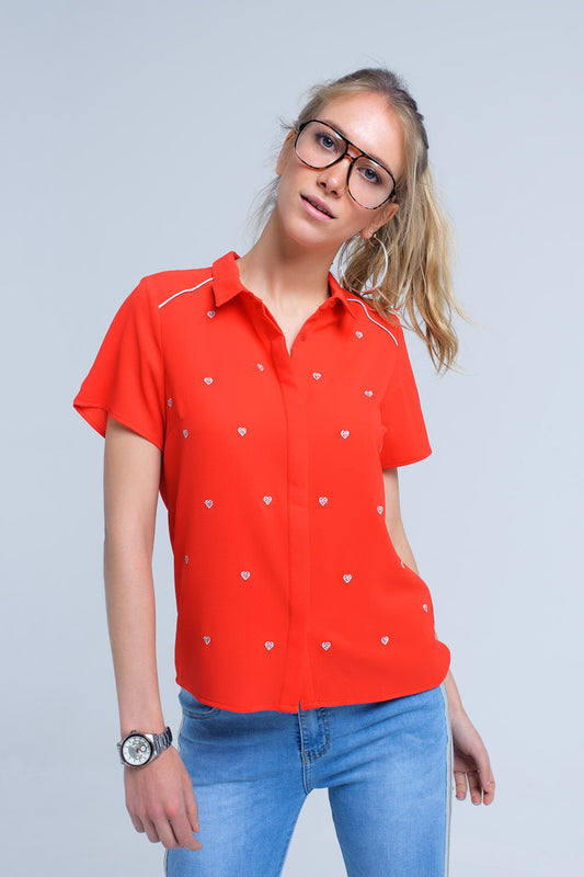 Q2 Red shirt with heart embroidery