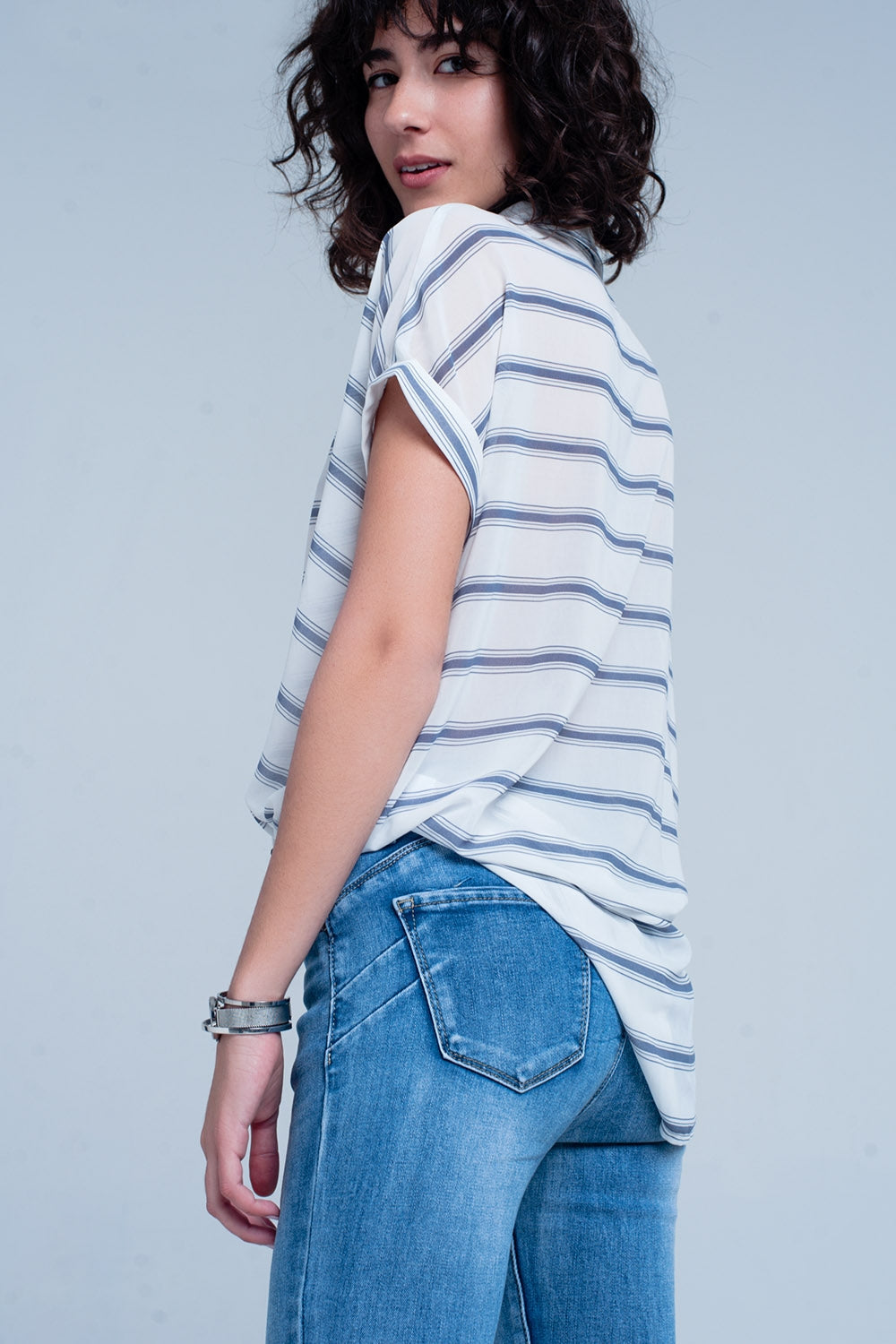 White short sleeve drape wrap blouse with blue striped designShirts