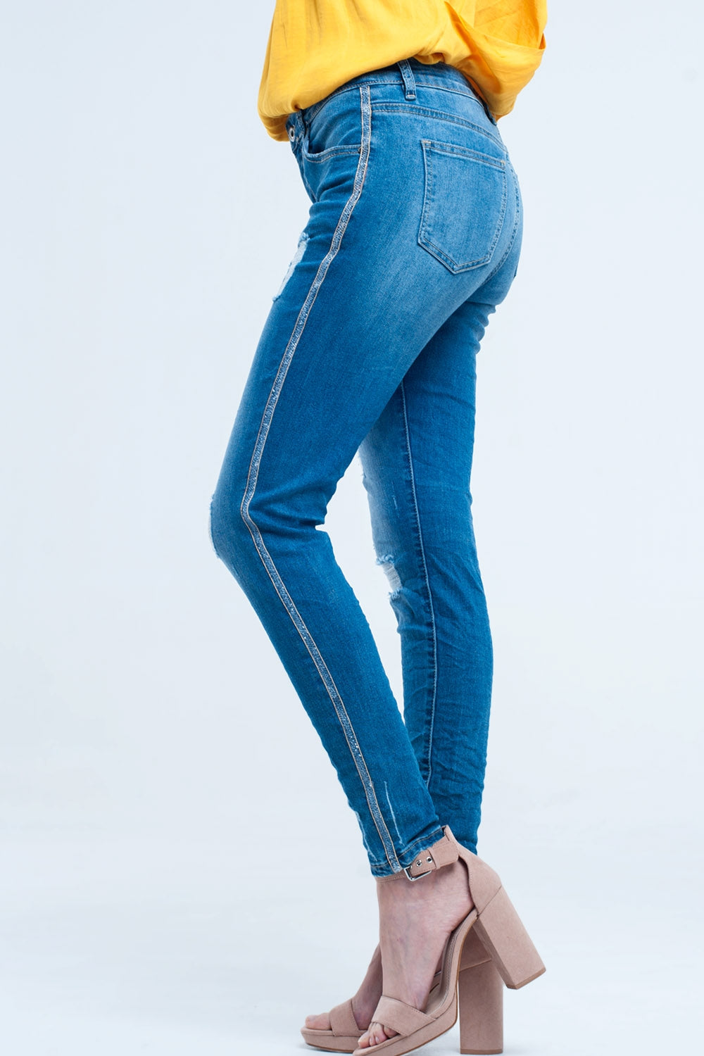Q2 Skinny jeans with rips and glitter line