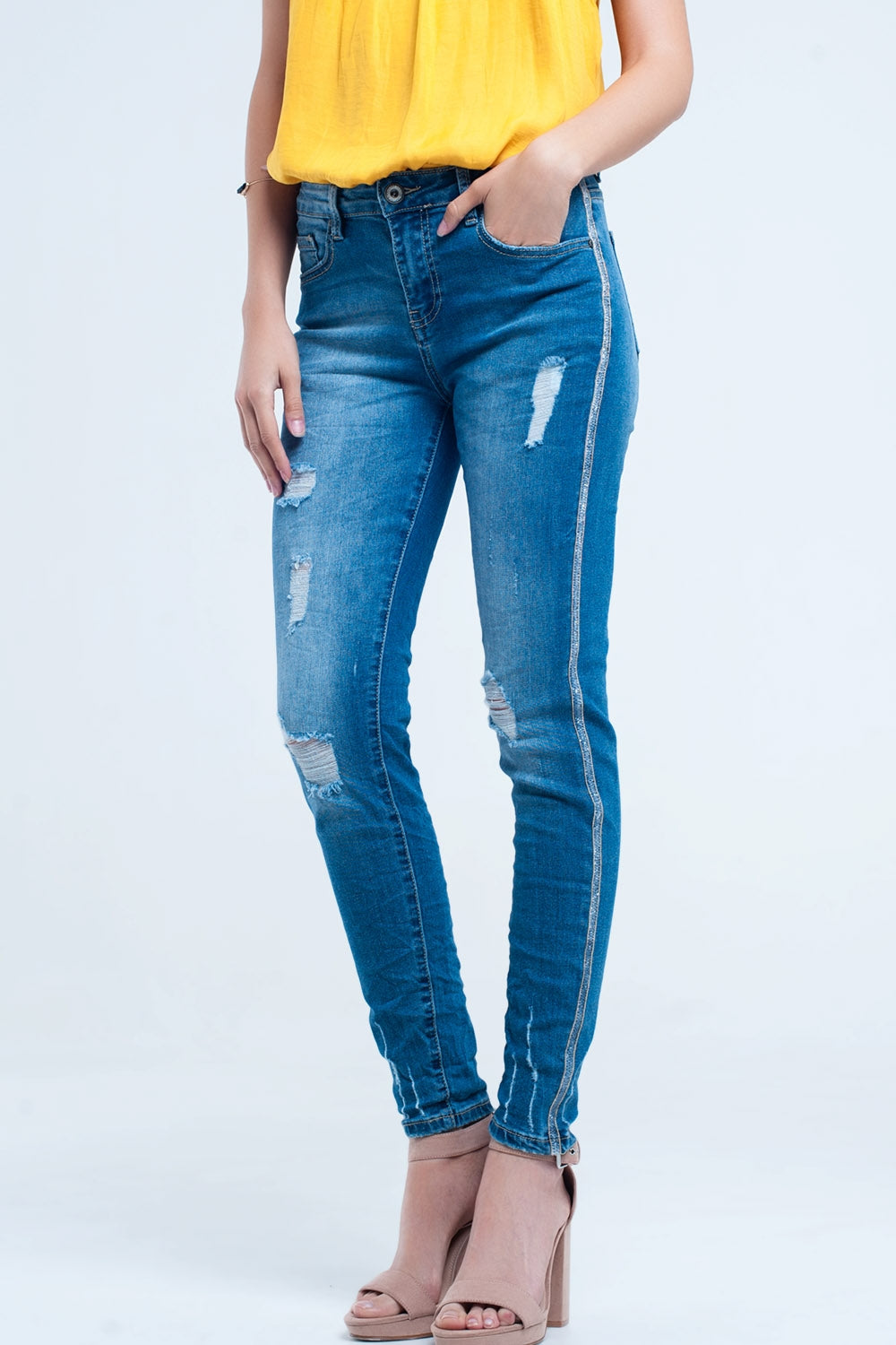 Skinny jeans with rips and glitter lineJeans
